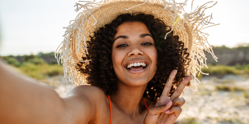 Woman taking a selfie on the beach